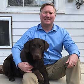 Matt with the family dog Ike.